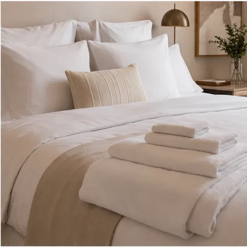 Stack of fresh white hotel-quality linen and towels